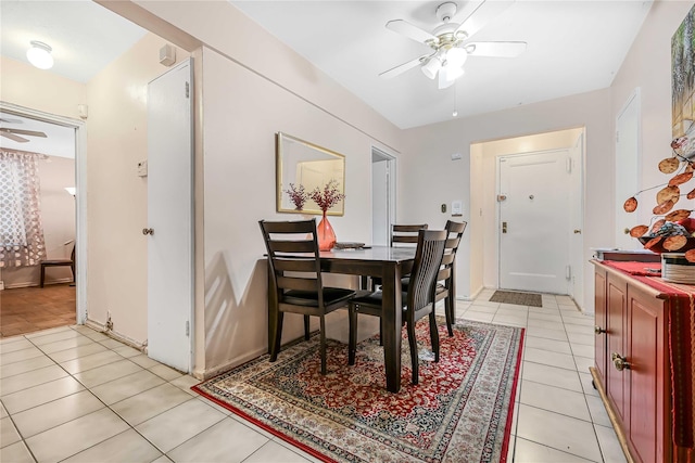 dining room featuring light tile patterned floors and ceiling fan