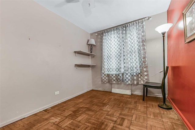 unfurnished room with lofted ceiling, parquet floors, and ceiling fan