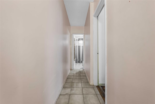 corridor featuring light tile patterned floors