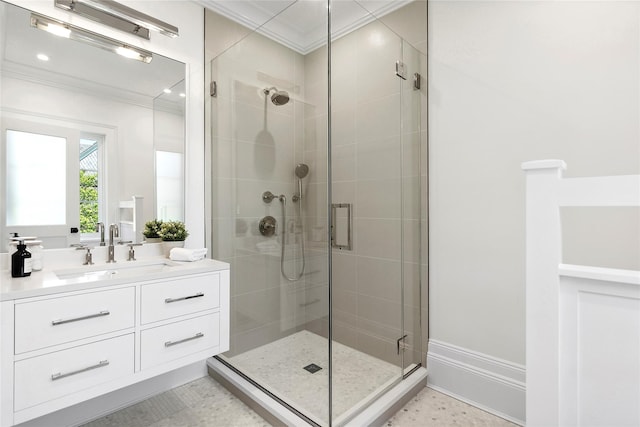 bathroom with crown molding, an enclosed shower, and vanity