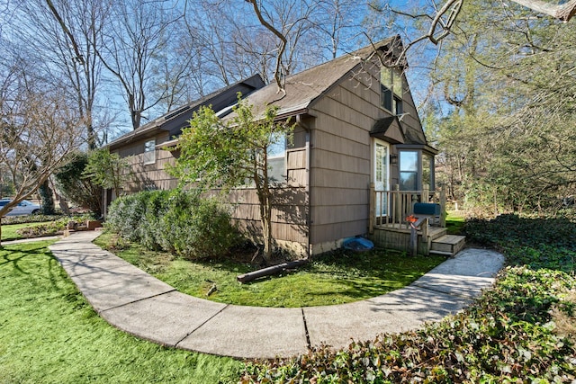 view of property exterior featuring a yard