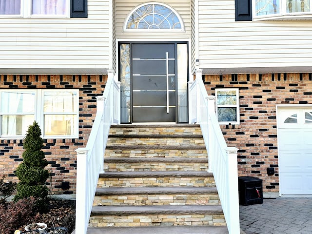 entrance to property featuring a garage