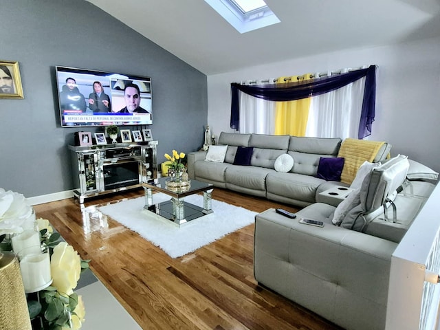 living room with lofted ceiling with skylight and wood-type flooring