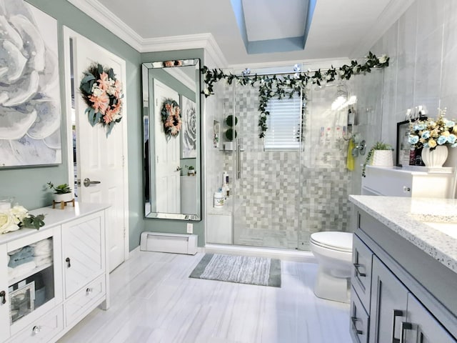 bathroom featuring crown molding, vanity, toilet, and walk in shower