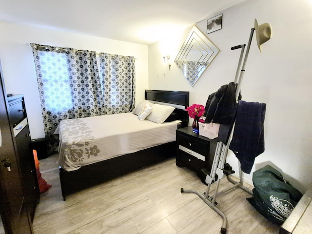 bedroom with light wood-type flooring