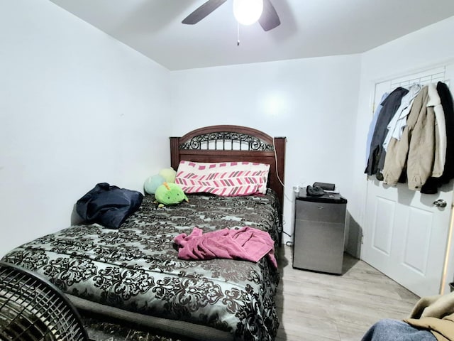 bedroom featuring ceiling fan and light hardwood / wood-style floors