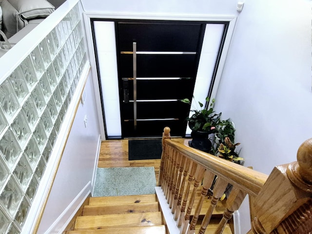 entryway with hardwood / wood-style floors