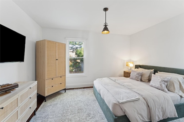 carpeted bedroom with baseboards