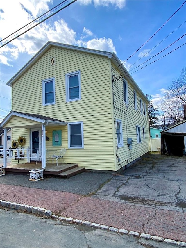 view of front of house featuring a deck and a porch