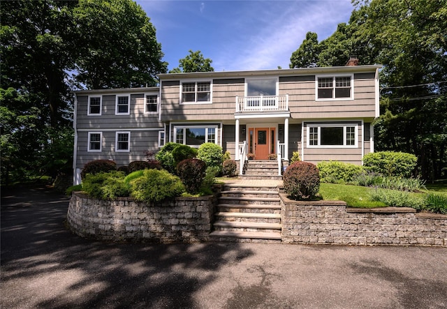 view of front of home with a balcony