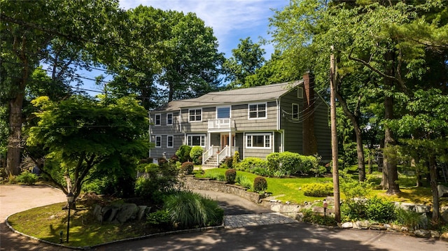 view of front of home with a balcony