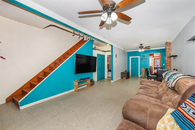 living room featuring ornamental molding and ceiling fan