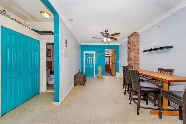 dining space featuring crown molding and ceiling fan