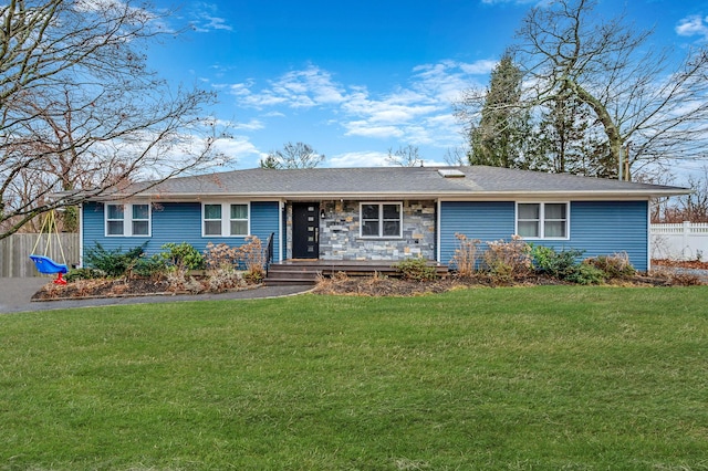 ranch-style home featuring a front lawn