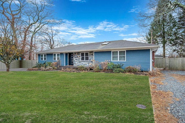 ranch-style home with a front yard