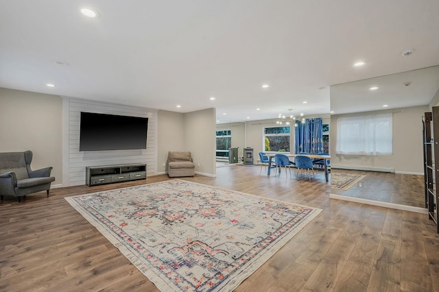 living room featuring hardwood / wood-style flooring and a chandelier