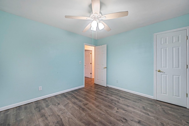 unfurnished bedroom featuring dark hardwood / wood-style floors and ceiling fan