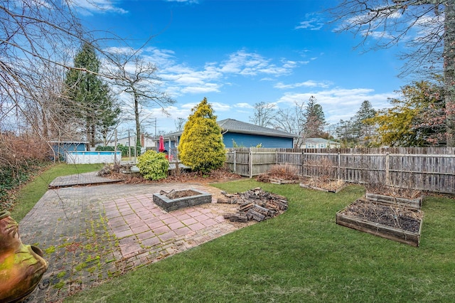 view of yard with a fire pit and a patio