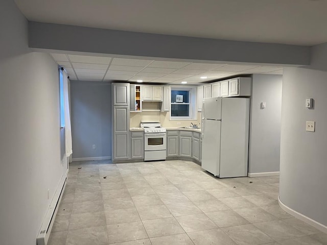 kitchen with sink, white appliances, gray cabinets, a baseboard heating unit, and a drop ceiling