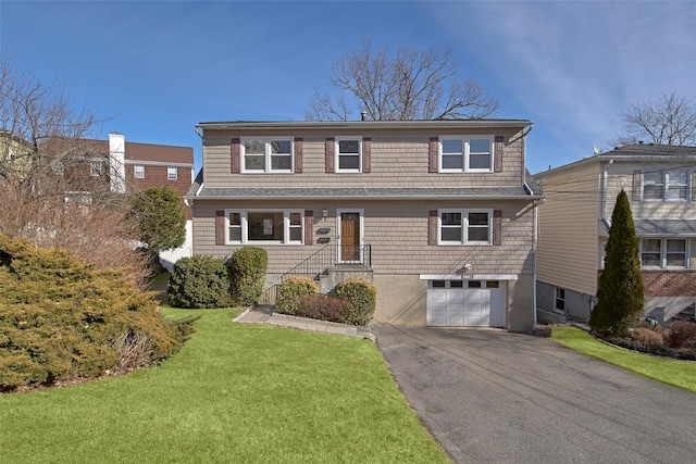 front of property featuring a garage and a front yard