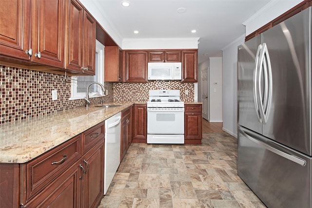 kitchen with sink, crown molding, tasteful backsplash, white appliances, and light stone countertops