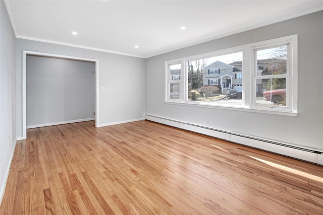 unfurnished bedroom with light hardwood / wood-style flooring, crown molding, and a baseboard radiator