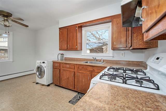 kitchen with sink, a wealth of natural light, exhaust hood, and white gas range oven