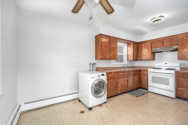 kitchen featuring sink, gas range gas stove, a baseboard radiator, ceiling fan, and washer / clothes dryer