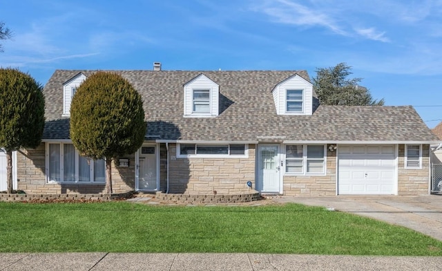 cape cod house with a garage and a front yard