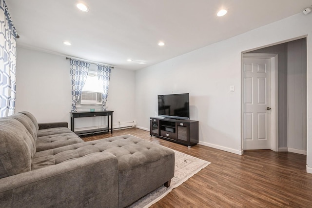 living room featuring cooling unit, a baseboard heating unit, and dark wood-type flooring