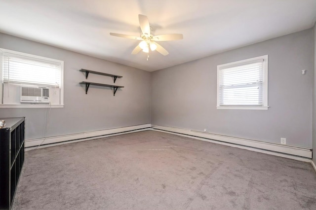 spare room featuring plenty of natural light, carpet, and a baseboard heating unit