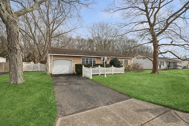 single story home featuring a garage and a front yard