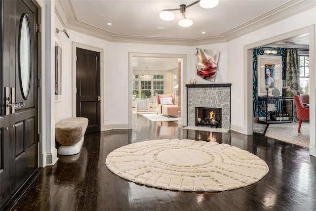 interior space featuring ornamental molding and dark hardwood / wood-style flooring