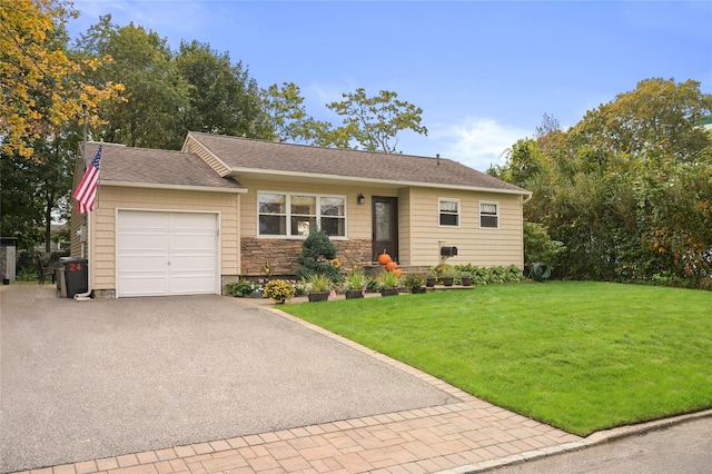 ranch-style home featuring a garage and a front yard