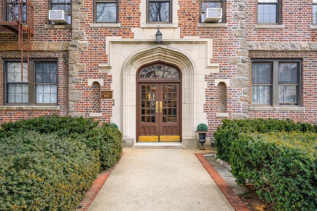 property entrance featuring french doors and cooling unit