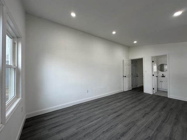 empty room featuring dark wood-type flooring