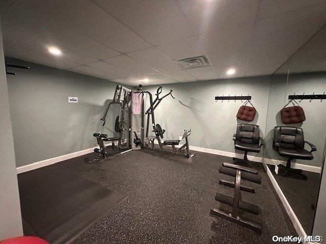 exercise area with a drop ceiling