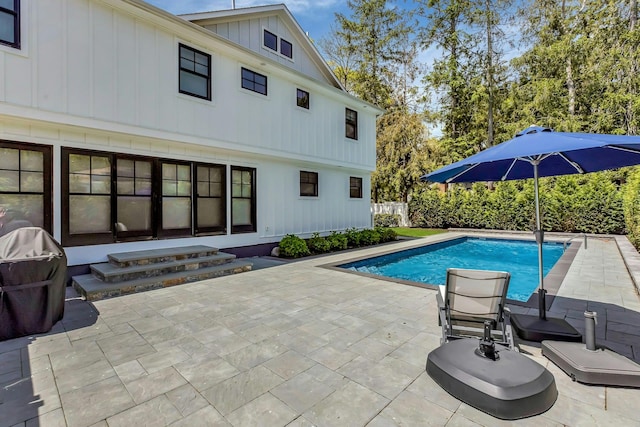 view of pool featuring a patio and area for grilling