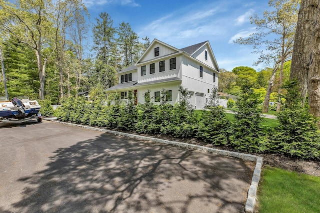 view of side of home with a garage