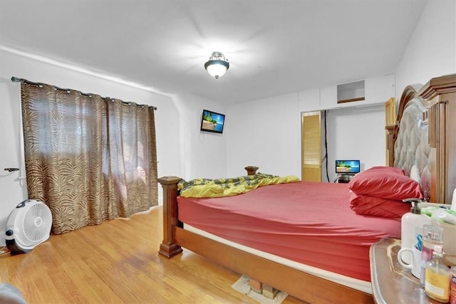 bedroom with wood-type flooring