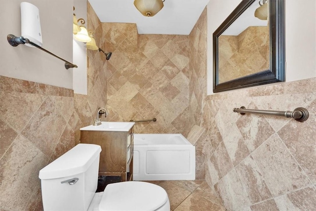 bathroom featuring a tub to relax in, toilet, tile walls, and vanity