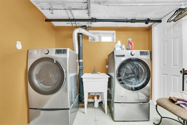 laundry area with washing machine and dryer