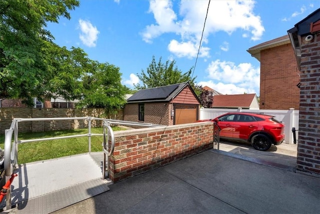 exterior space featuring an outbuilding and a garage