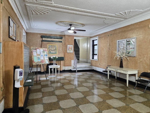 miscellaneous room featuring ceiling fan and ornamental molding