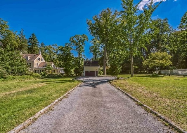 view of front of house featuring a garage and a front yard