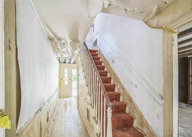 stairway featuring wood-type flooring