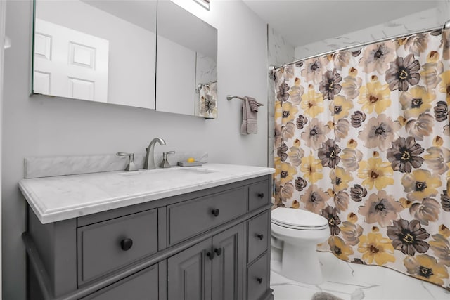 bathroom with marble finish floor, a shower with shower curtain, vanity, and toilet