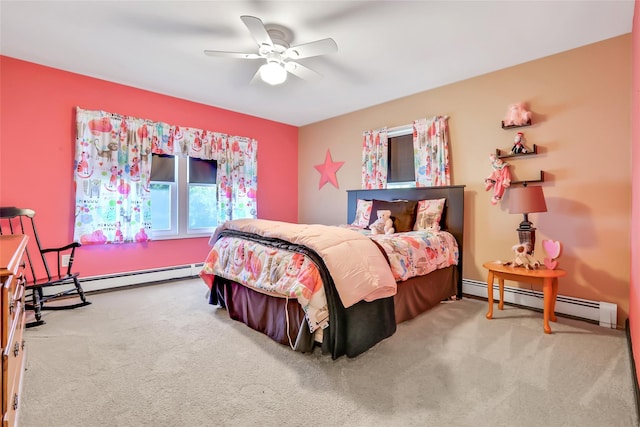 carpeted bedroom featuring a baseboard heating unit and ceiling fan