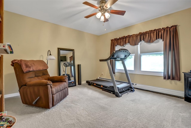 workout room with carpet, baseboards, and ceiling fan