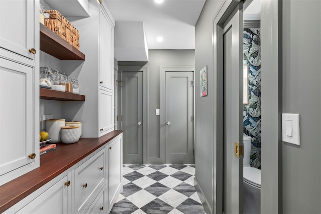 interior space featuring white cabinets